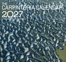 Load image into Gallery viewer, The front cover of The Carpinteria Calendar 2027, featuring a dense field of blue and silver velella velella, also known as the "By the wind sailors", a gorgeous shot taken in the water by our very own Rick Joy who created the calendar 23 years ago. 'THE CARPINTERIA CALENDAR 2027' and 'VISUAL TIDAL WAVES®'.